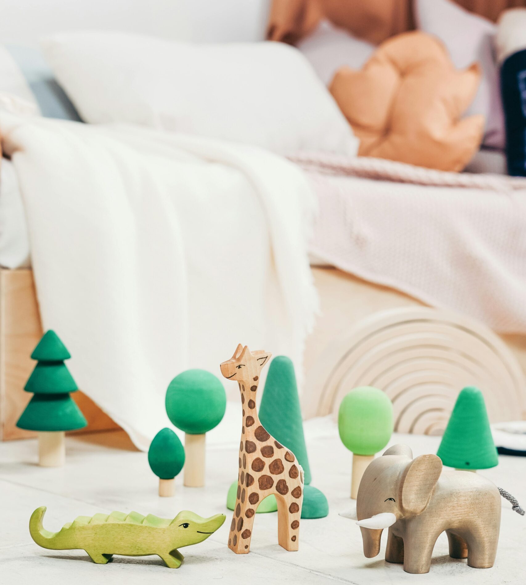 Minimalist playroom with wooden animal toys, perfect for creative child engagement.